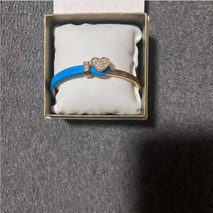 gold and blue guess bracelet
